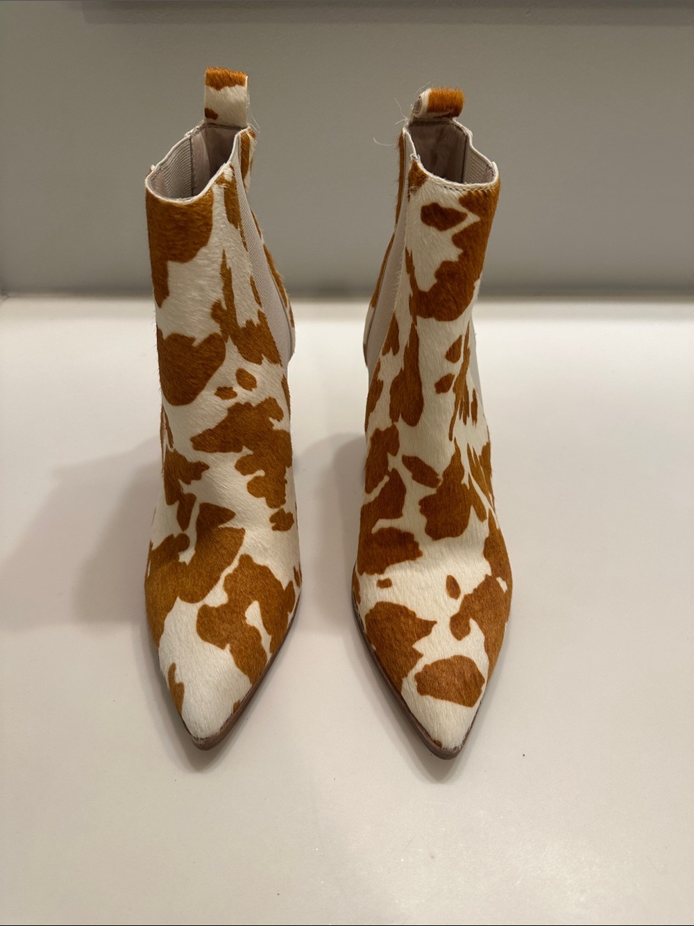 42 GOLD White & Brown Cow-Print Pointed Toe Ankle Boots